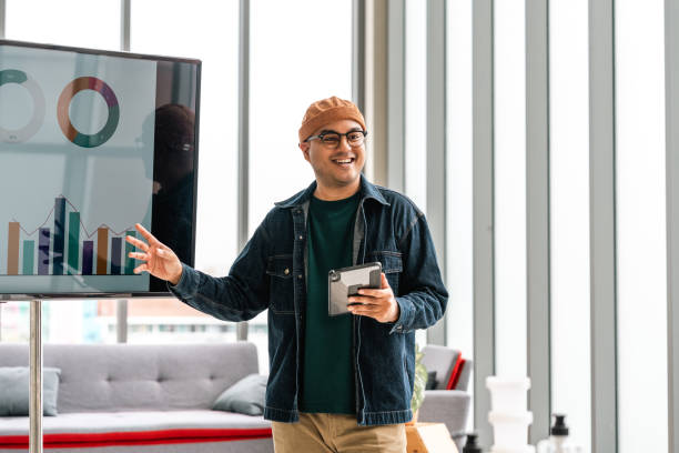 Asian business start up freelance people team analyzing statistics financial. Group Team of businesspeople man and woman Meeting Conference Discussion various topic Corporate Concept in office.