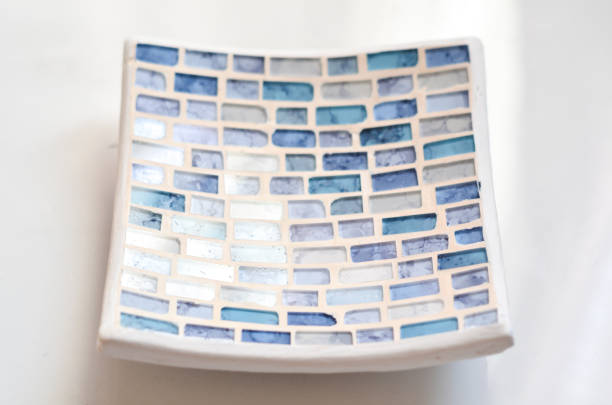Add a touch of elegance to your space with our white and light blue mosaic stand for decoration. Featuring a chic color palette and intricate mosaic design, this stand serves as a stylish and versatile home accent. Ideal for enhancing living rooms, dining areas, or entryways, it complements a variety of decor styles while adding a splash of sophisticated color. Perfect for those looking to infuse their home with a serene and refined aesthetic.