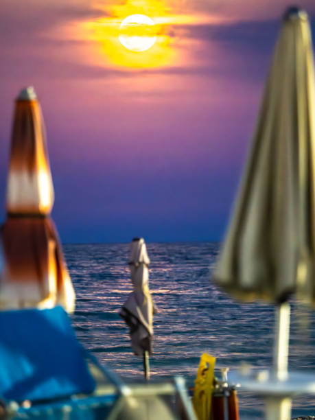 Sunrise through the umbrellas on the beach