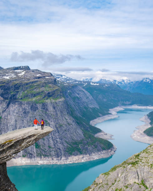 istock Couple on a Cliffside in Norway, Trolltunga, Norway 2163923874