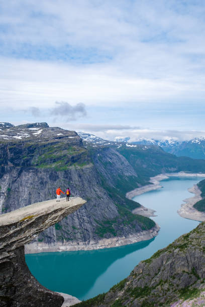 istock Two Hikers on the Trolltunga Cliff in Norway 2163924099