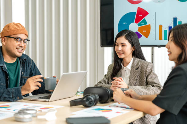 istock Asian business start up freelance people team analyzing statistics financial. Group Team of businesspeople man and woman Meeting Conference Discussion various topic Corporate Concept in office. 2163924331
