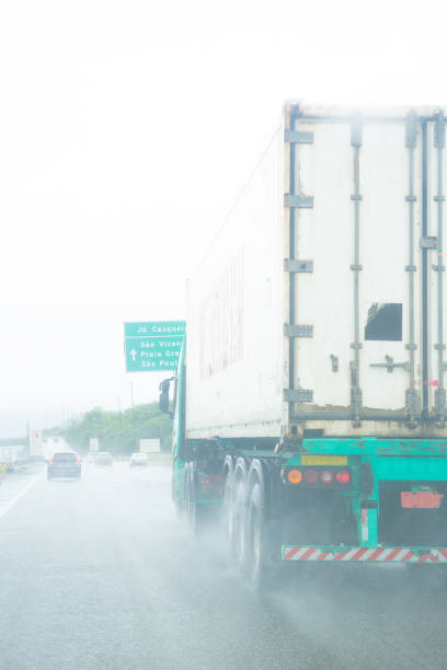 istock Truck on the road during a rainy day 2163924894