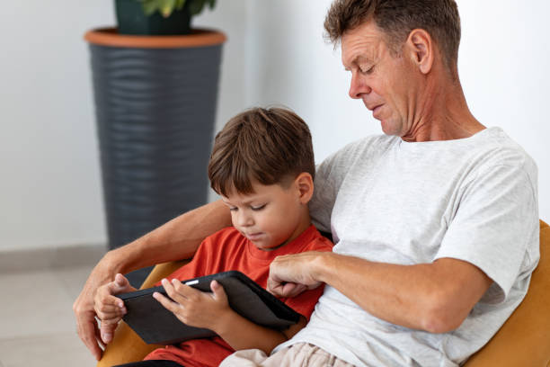 istock A father and his six-year-old son use a tablet 2163925715