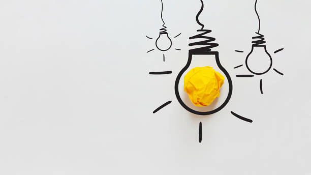 istock Yellow crumpled paper light bulb drawn on a white background. Brainstorm and creative idea, concept. Project and startup. Every thing begins with Idea 2163925900