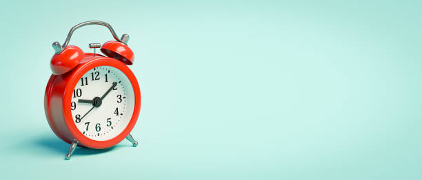 istock Red Alarm Clock on Light Blue Background with Copy Space 2163927124