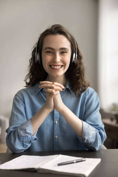 istock Girl in headphones pose for camera during educational e-learning process 2163927157