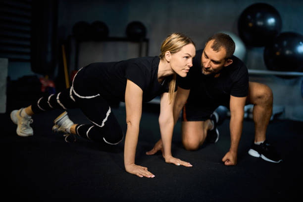 istock Young sportswoman doing push-ups during exercise 2163927171