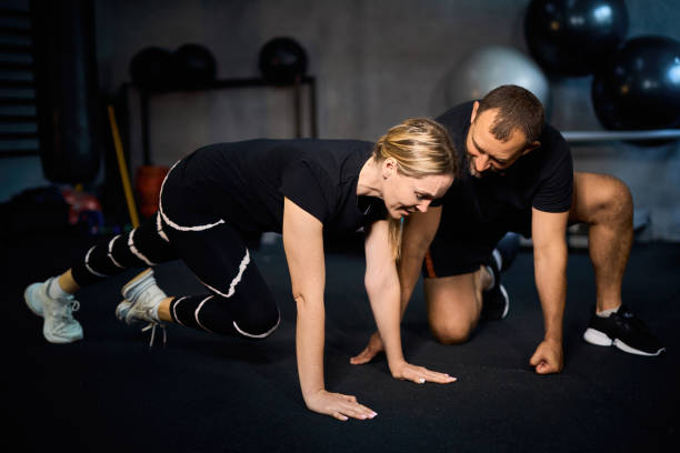 istock Young sportswoman doing push-ups during exercise 2163927923