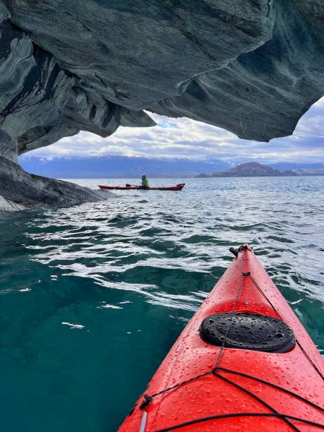 Kayaking through caves, Patagonia Personal perspective kayaking through caves, Catedral de Marmol, Carretera Austral, Patagonia carretera austral chile stock pictures, royalty-free photos & images
