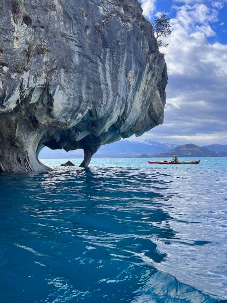 Kayaking through caves, Patagonia Kayaking through caves, Catedral de Marmol, Carretera Austral, Patagonia carretera austral chile stock pictures, royalty-free photos & images