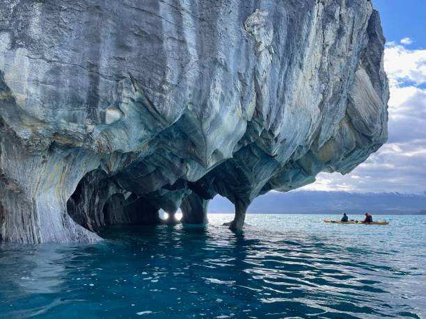 Kayaking through caves, Patagonia Kayaking through caves, Catedral de Marmol, Carretera Austral, Patagonia carretera austral chile stock pictures, royalty-free photos & images