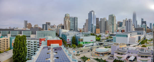 San Francisco, California San Francisco, California - June 19, 2024: A very foggy morning view of San Francisco taken from Shelby's Rooftop of Canopy by Hilton San Francisco Hotel. HDR encoded. solar panels on the roof of building in a city stock pictures, royalty-free photos & images