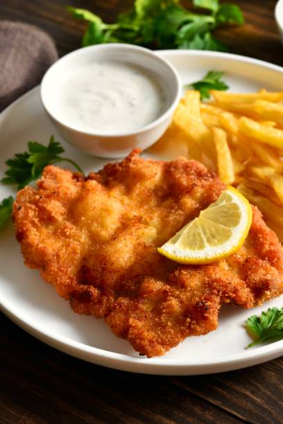 istock Wiener schnitzel with potato fries 2163931847