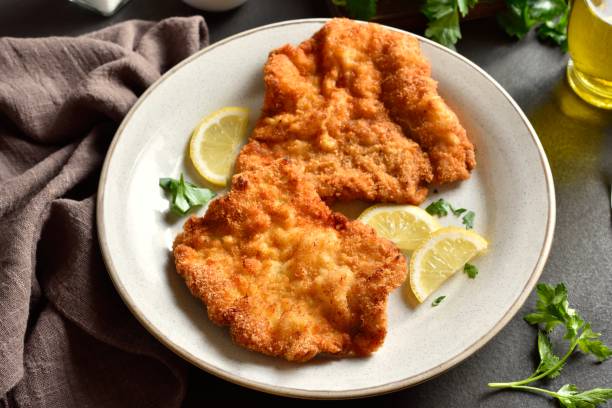istock Schnitzel with lemon and leaves of parsley 2163931864