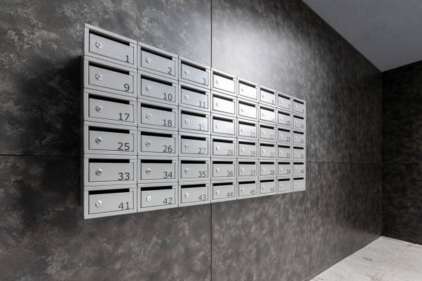 istock Many post boxes in modern apartment building. Postage boxes in an apartment complex. 2163940199