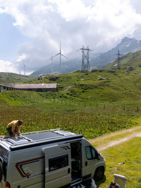 istock Camper Van Solar Panel Maintenance at Mountain Lake 2163940322