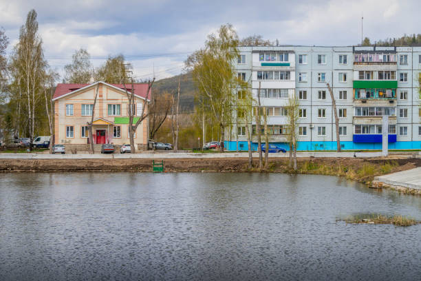The Zhigulevsk city streets and the town pond in Samara oblast, Russia, with typical Russian architecture The Zhigulevsk city streets and the town pond in Samara oblast, Russia, with typical Russian architecture and grocery shop. zhiguli car stock pictures, royalty-free photos & images