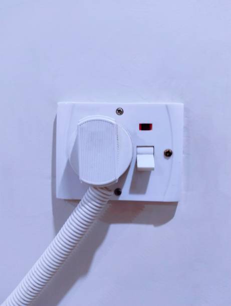 istock A.C power plug and socket point board, prise courant, enchufe, tomada, closeup image stock photo 2163942520
