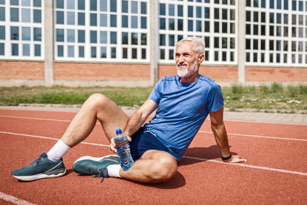 istock Confident mature athlete runner taking a break sitting 2163948460
