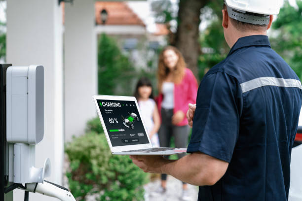 istock Qualified technician working with laptop for home EV station. Synchronos 2163950782