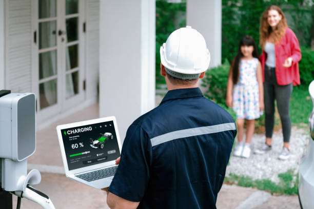 istock Qualified technician working with laptop for home EV station. Synchronos 2163951430