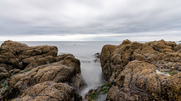 istock Water rushing between rocks on the scottish coastline 2163951612