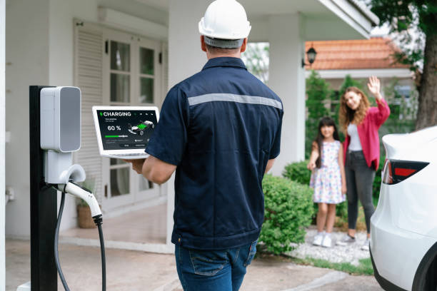 istock Qualified technician working with laptop for home EV station. Synchronos 2163952040