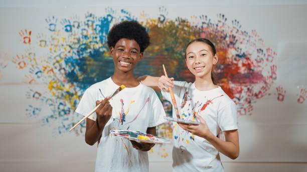 istock Student with mixed races smile and look at camera at art lesson. Edification. 2163954659