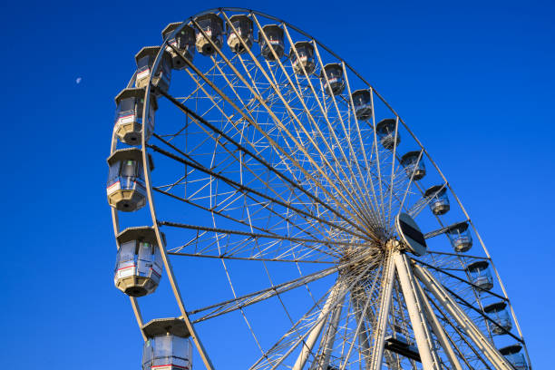 istock Ferris wheel with blue sky background 2163957370