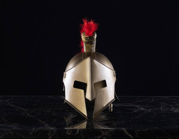 istock golden spartan helmet on black background 2163960411