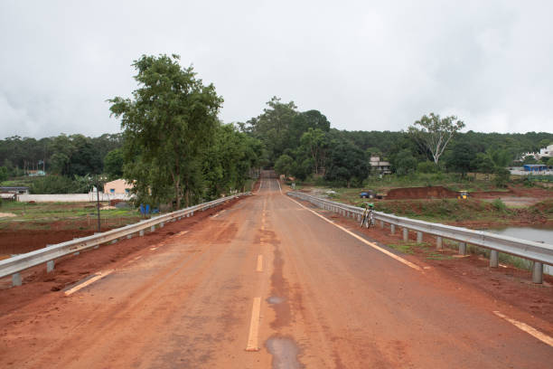 istock stretched muddy road of rural development 2163960732