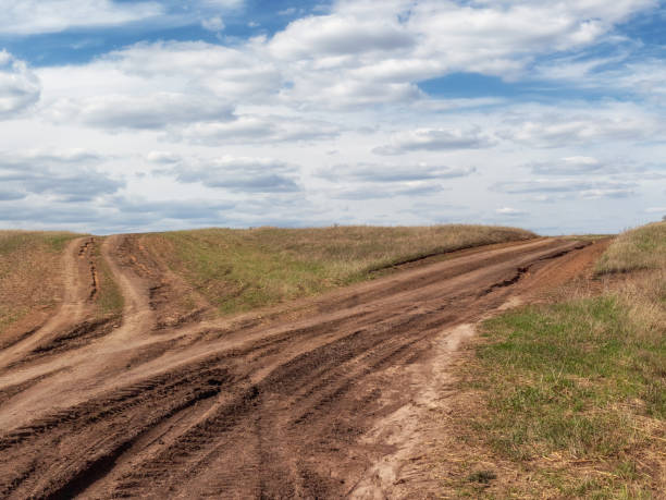istock Fork in the dirt road. 2163965089