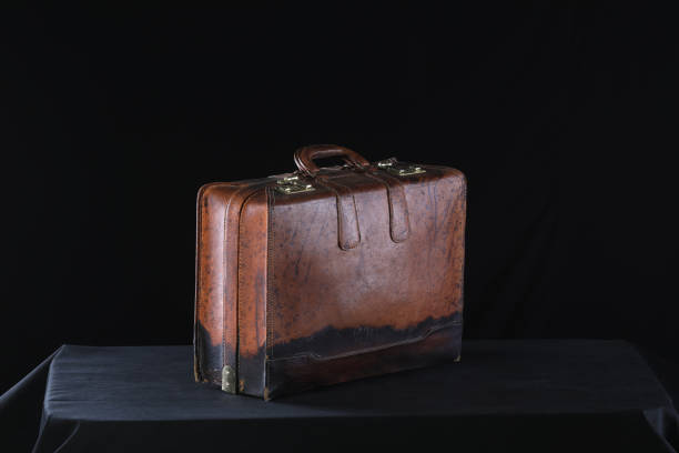 Blue suitcase with handle and black