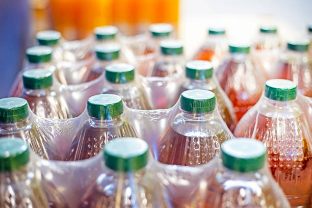 istock juice and other drinks packed in plastic containers with green plastic lids 2163966699