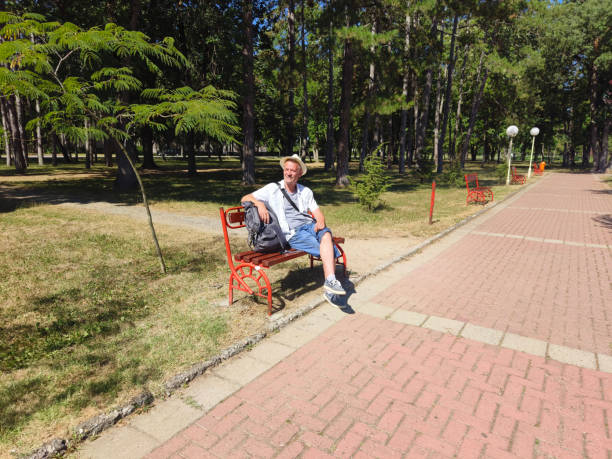 Tourist visit European town in sunny summer day and catching moments of joy with mobile phone