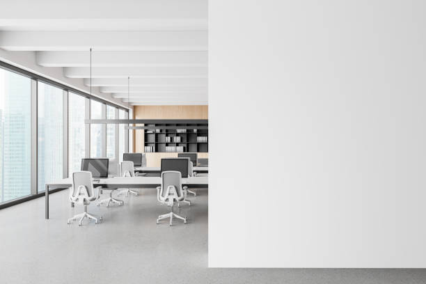 istock Modern office workspace with large windows and white furniture, minimalist style, concrete floor, and cityscape background. Concept of contemporary office design. 3D Rendering 2163970813
