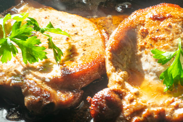 Pork chops on the cooking pan