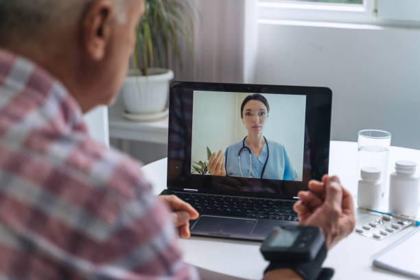 istock Older man monitors health during online doctor call 2163971908