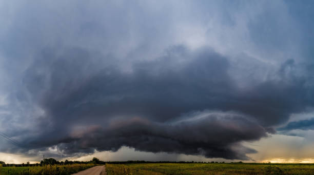 istock Summer storm cloud hovering over farm field 2163972878