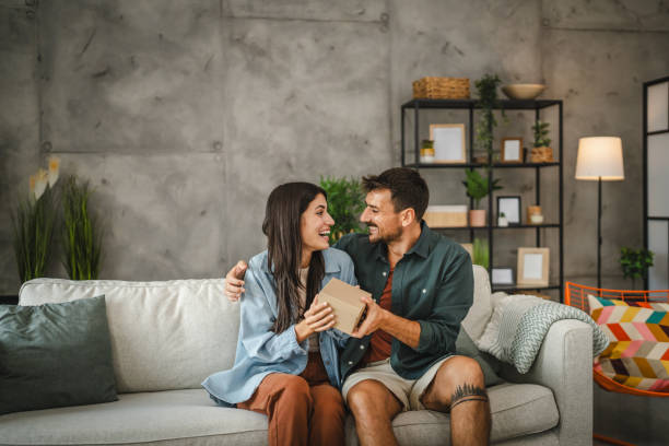 istock Boyfriend surprise his girlfriend for birthday with gift present 2163974414