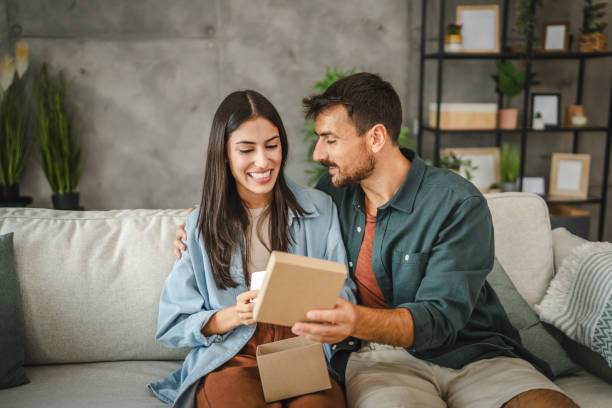 istock Boyfriend surprise his girlfriend for birthday with gift present 2163974525