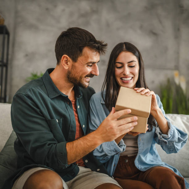 istock Boyfriend surprise his girlfriend for birthday with gift present 2163975169