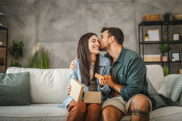 Girlfriend read greeting card thank you note from his boyfriend