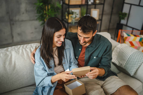 istock Boyfriend surprise his girlfriend for birthday with gift present 2163975357