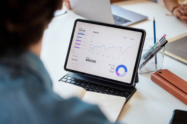 istock Business Report On Tablet Displaying Financial Data and Charts 2163977175