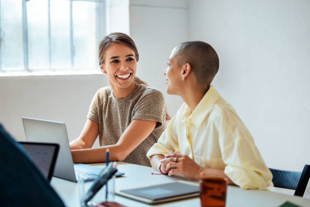 istock Happy Colleagues Discussing Work at Laptop in Office Meeting 2163977180