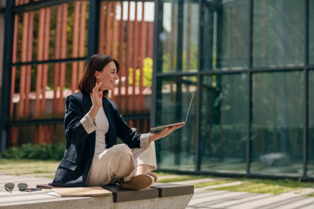 istock A young professional woman is having a virtual meeting outdoors using her laptop 2163978548