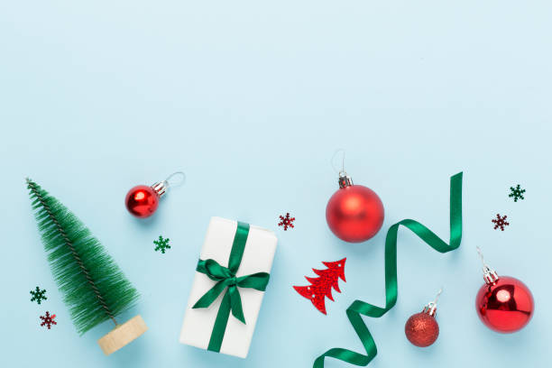 istock Small christmas tree with decor on color background, top view 2163981780
