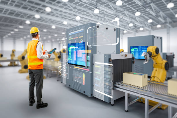 istock Technician or engineer work with robotic arms in factory 2163983269